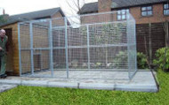 Kennel attached to a wooden outbuilding...